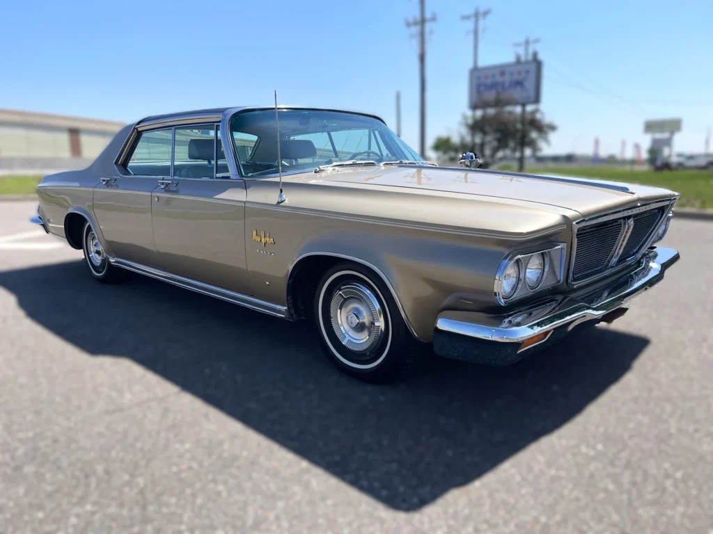 A brown car parked on the side of a road.