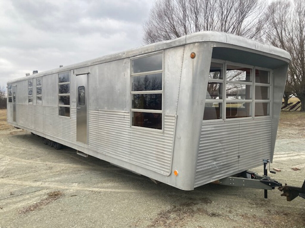 A trailer that is parked in the street.